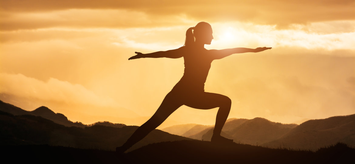 Woman Doing Yoga at Sunset