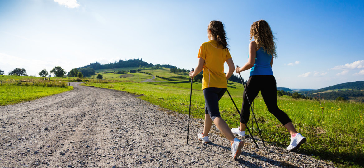 Nordic walking - active people working out outdoor